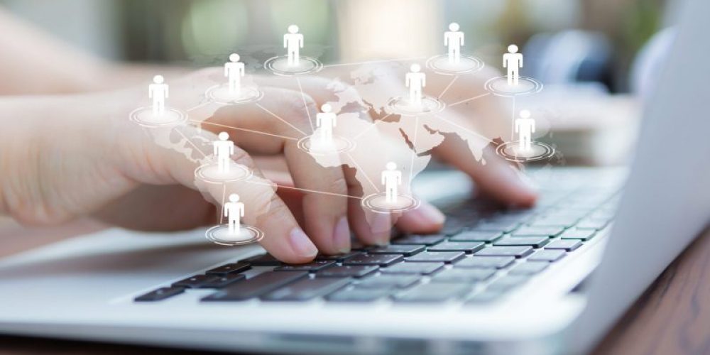 Closeup of business woman hand typing on laptop keyboard