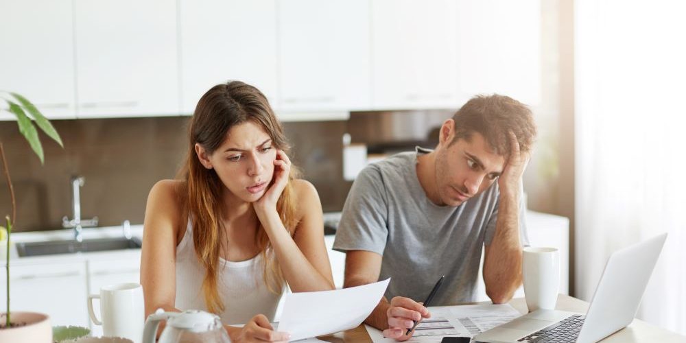 young-couple-checking-their-family-budget